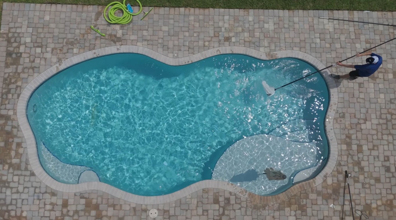 Aerial view of professionally cleaned pool in Vista, CA